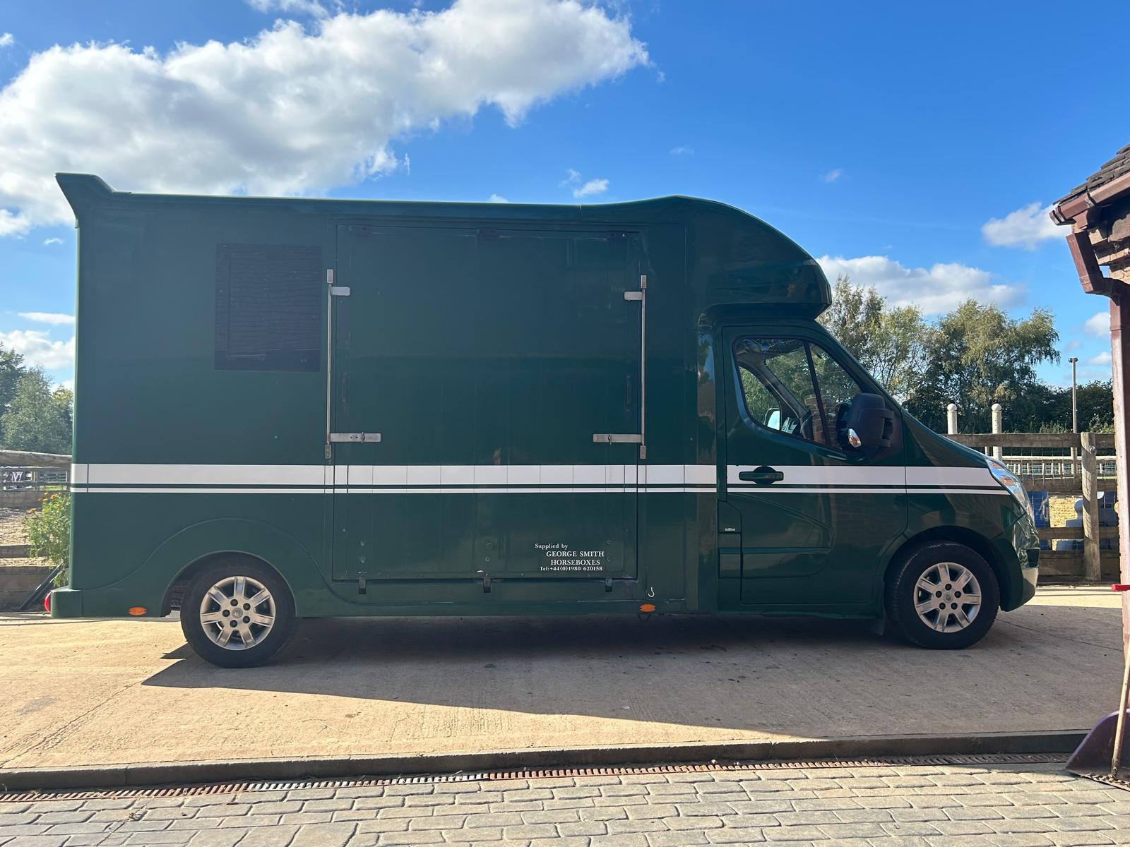 NEEDARIDE green horsebox on the road